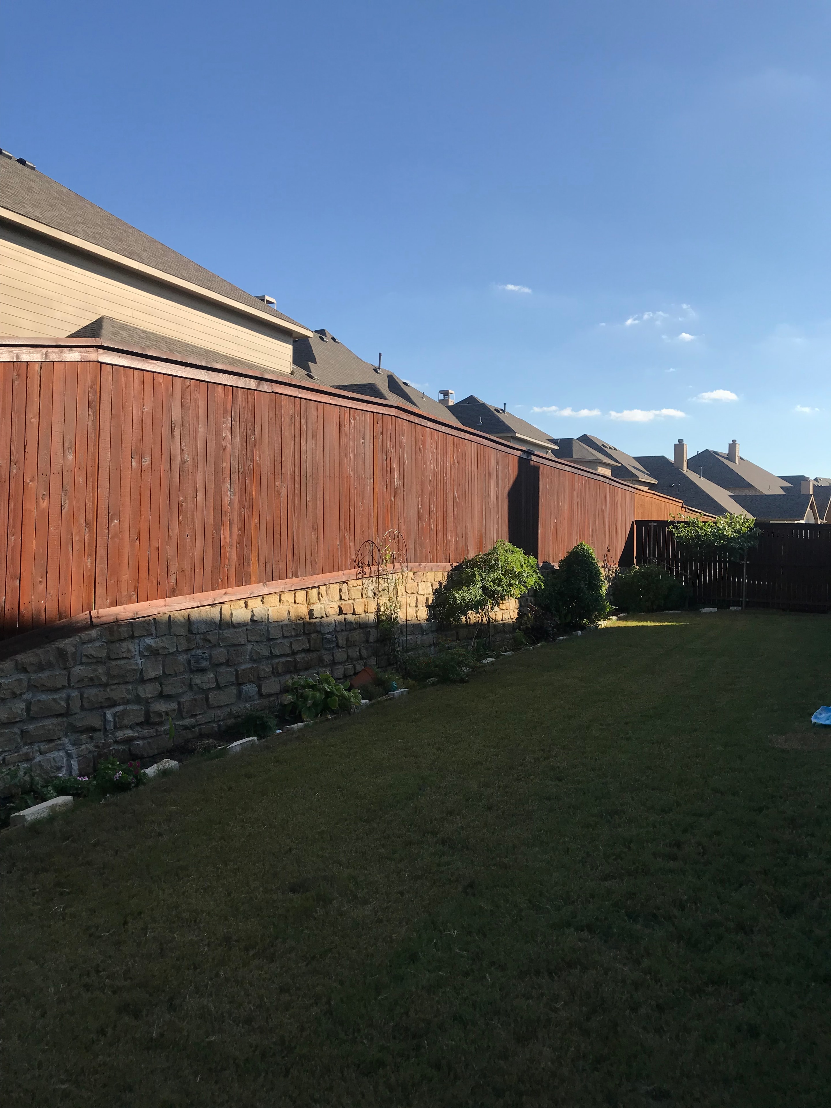 Outdoor wood structure after professional staining — protected and refreshed